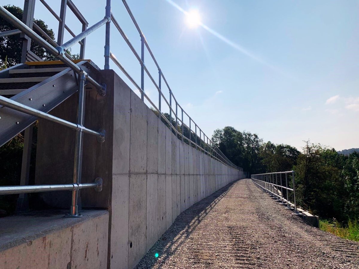 Composite access steps installed beside rail infrastructure